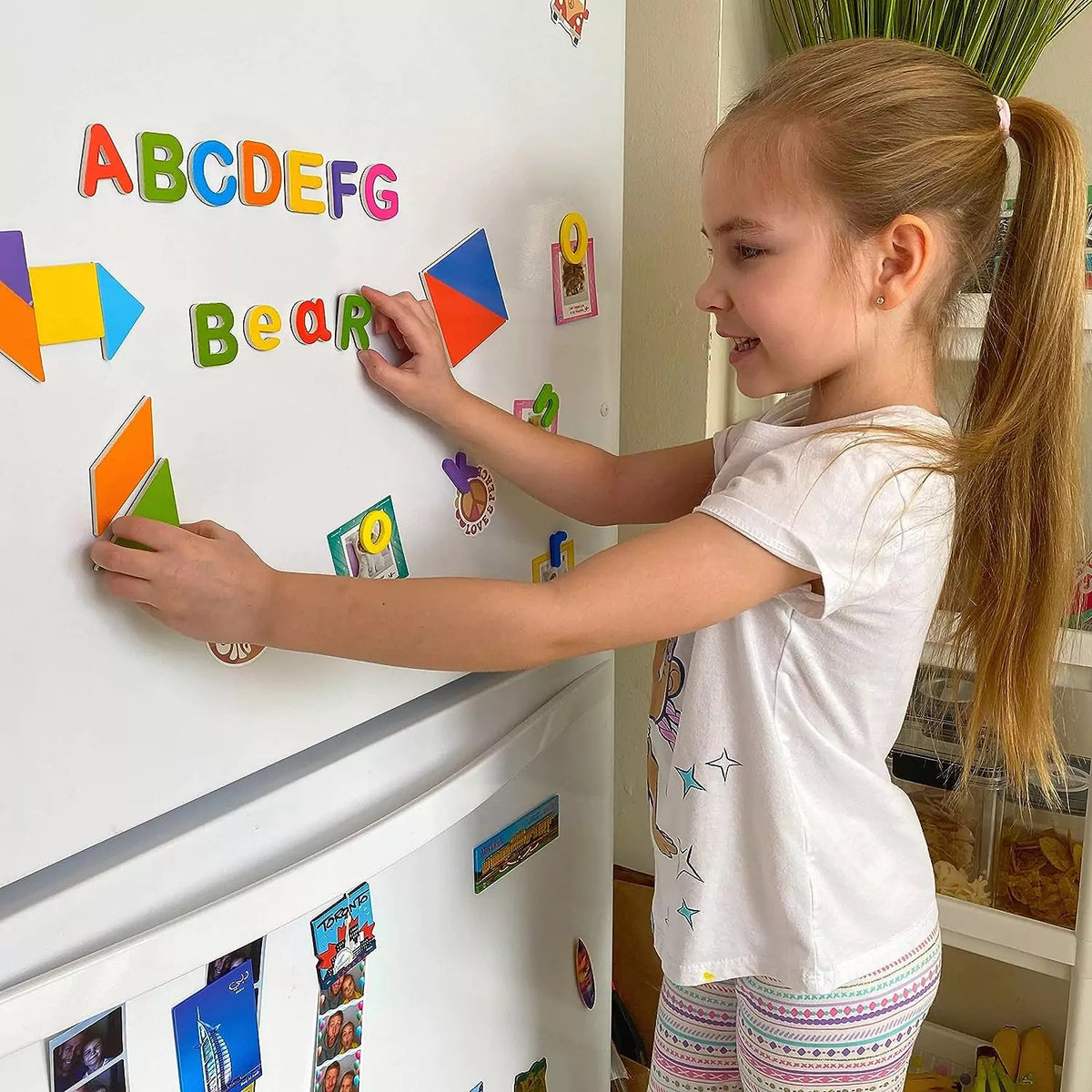 Colorful ABC magnetic letters on fridge