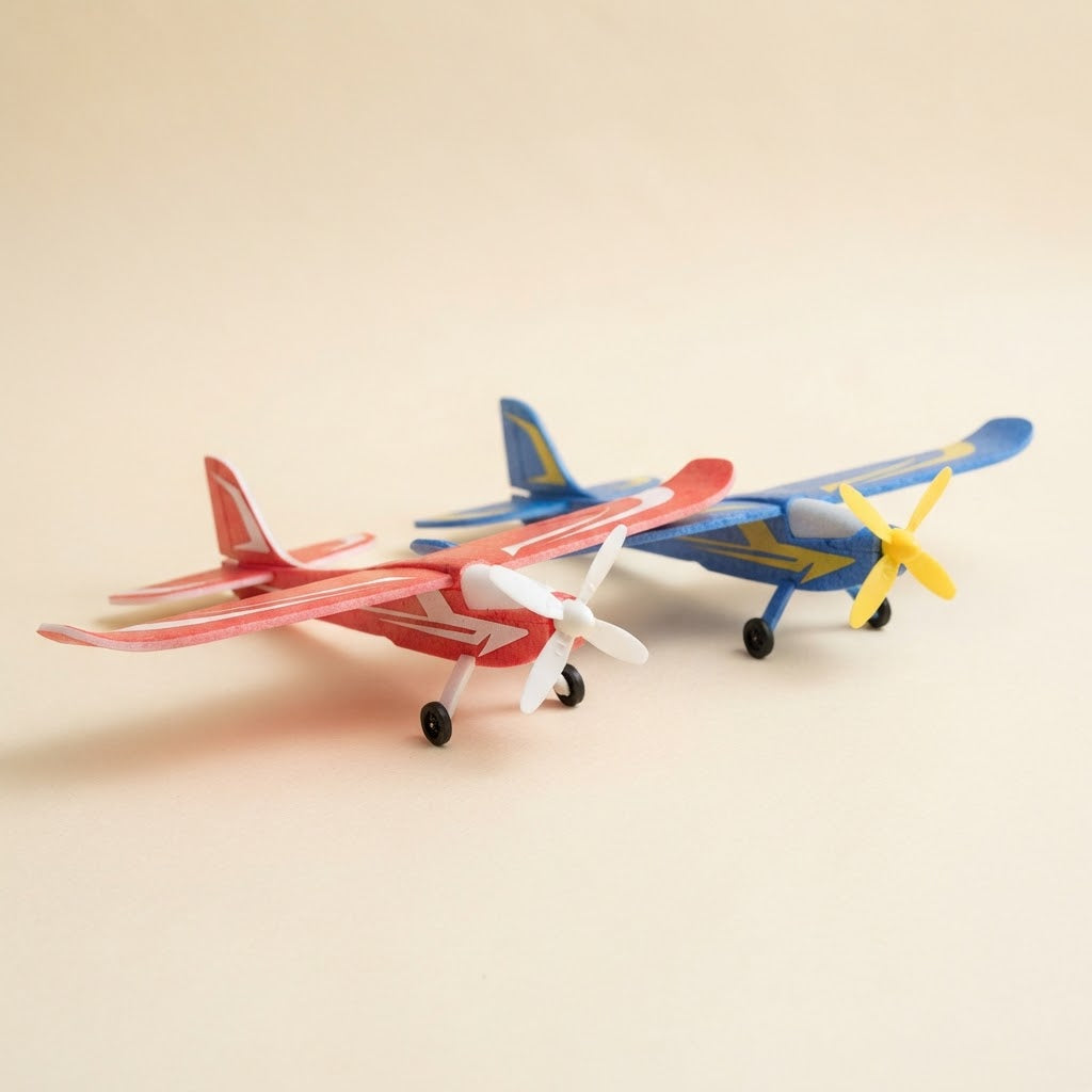 Two foam glider planes in red and blue