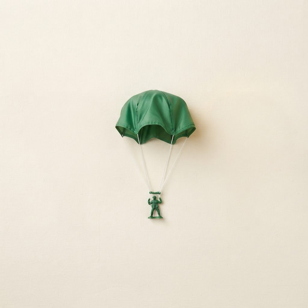 Single green toy parachute