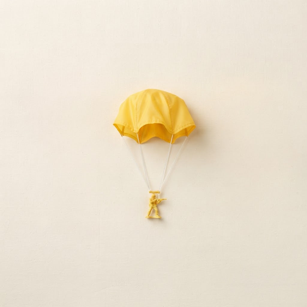 Single yellow toy parachute