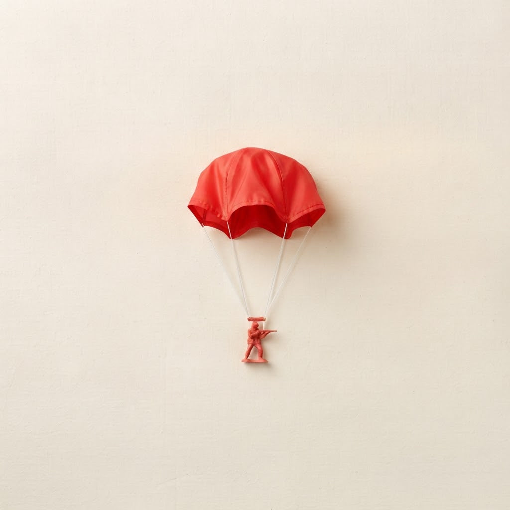 Single red toy parachute